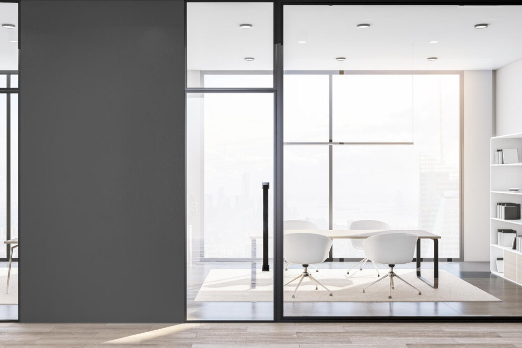 Framed glass office door with aluminium fittings in professional workspace